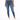 A model wearing fitted blue jeans paired with a white cropped top and white sneakers, standing against a plain backgr...