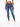 A model wearing fitted blue jeans paired with a white cropped top and white sneakers, standing against a plain backgr...