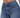 Close-up of a person wearing high-waisted blue denim jeans with a button closure and subtle stitching details.