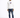 A man stands confidently in a white hoodie with a graphic design, paired with distressed blue jeans and black sneakers.