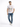 A young man wearing a white graphic t-shirt with a lion design, paired with distressed blue jeans and white sneakers.