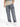 Casual gray cargo jeans with multiple pockets, styled with a beige gradient shirt and white sneakers.