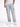 Light blue distressed jeans with cargo pockets, styled with a white t-shirt and white sneakers.