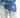 Faded blue jeans featuring a distressed design with light and dark wash contrasts.