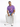 A man sits on a white cube wearing light blue distressed jeans, a purple graphic t-shirt, and white sneakers.