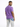 A man with short hair wearing a purple t-shirt and light blue tie-dye jeans, looking over his shoulder.