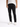 A person wearing fitted black jeans and white sneakers, standing against a plain background.