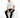 A man sits on a white cube, wearing a casual white t-shirt and black jeans, paired with white sneakers.