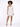 A model poses in a fitted, one-shoulder, sparkly dress, showcasing a stylish silhouette and strappy heels.