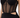 Close-up of a black apparel item featuring a structured bodice with sheer mesh panels and cut-out details.