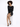 A model poses in a fitted black sequined dress with long sleeves, paired with black high heels.