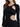 A fitted black dress featuring long sleeves and stylish cut-out details at the waist.