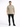 A man stands confidently in a light beige t-shirt paired with black jeans and sneakers against a plain background.