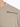 Light olive green t-shirt featuring a crew neck and black text graphic on the upper left side.