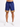 Navy blue shorts with a colorful geometric pattern at the hem, paired with white sneakers.