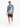 A man wearing a colorful short-sleeve shirt with a vibrant graphic design and matching shorts, paired with white snea...