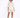 A model poses in a light beige button-up shirt and matching shorts, complemented by black heeled sandals.
