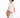 A model poses on a white pedestal wearing a light beige short-sleeve shirt and matching shorts with black heeled mules.