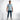A man stands confidently in a light blue t-shirt with embossed text, paired with fitted jeans and stylish boots.
