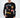 A model wearing a black long-sleeve shirt featuring colorful graphic designs and playful text elements.