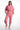 A model poses in a pink cropped hoodie and matching joggers, showcasing a casual and comfortable style.
