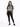 A woman stands confidently in a tie-dye graphic tee featuring a tiger design, paired with black skinny jeans and snea...
