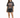 A woman stands wearing a vintage-style graphic t-shirt with an eagle design, paired with black shorts and sneakers.