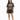 A woman stands wearing a vintage-style graphic t-shirt with an eagle design, paired with black shorts and sneakers.