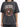 A loose-fitting, dark gray t-shirt featuring a graphic of an eagle and bold text in a vintage style.