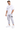 A man stands confidently in a white oversized t-shirt and light gray cargo pants, paired with white sneakers.