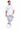 A man stands confidently wearing a white graphic t-shirt and light gray cargo pants with white sneakers.