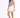 A model poses in a light purple cropped top paired with white shorts and white sneakers.
