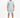 A man stands wearing a light blue ribbed t-shirt and matching shorts, paired with black and white sneakers.