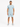 A man stands wearing a light blue ribbed t-shirt and matching shorts, paired with black and white sneakers.