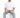 A man sits on a white cube, wearing a plain white t-shirt and embellished light blue jeans with white sneakers.