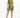 A model poses in olive green fitted shorts and a matching one-shoulder crop top, paired with white sneakers.
