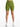 Form-fitting green shorts with a high waist, paired with white athletic shoes, displayed against a plain background.
