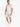 A man stands wearing a light gray short-sleeve shirt and matching shorts with a subtle palm leaf pattern.