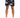 Men's black shorts featuring a colorful abstract floral pattern, paired with white sneakers.