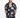 A man models a short-sleeve shirt with a colorful abstract pattern on a black background.