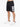 Black athletic shorts with a large white number graphic, paired with white sneakers and a casual fit.