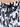 Close-up of swimwear featuring a black and white abstract pattern with a drawstring closure.