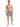 A shirtless man stands in patterned swim shorts and slide sandals, showcasing a casual beach look.