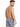 A man with short hair is wearing patterned swim shorts, showcasing a stylish design from a rear angle.
