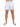 Men's swim shorts featuring a colorful sailboat pattern on a white background, paired with slide sandals.