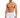 A man with a toned physique poses in swim trunks featuring a colorful sailboat pattern on a white background.