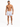A man stands confidently in patterned swim trunks featuring colorful sailboats, paired with casual slide sandals.