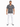 A man stands confidently in a patterned short-sleeve shirt, paired with distressed white jeans and casual sneakers.