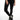 A close-up of a person wearing black leggings paired with stylish black and silver high-top sneakers.