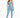A model wearing a light blue one-shoulder crop top paired with matching leggings and white sneakers.